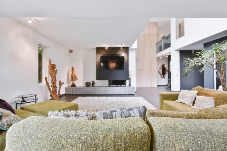 Cozy large living room with a yellow sofa in daylight